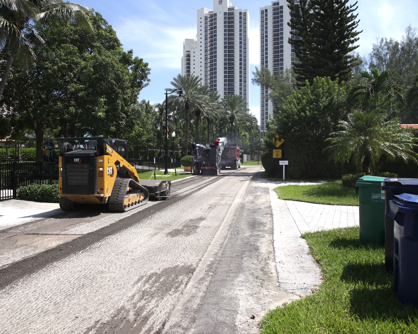 Construction equipment working on the road in Golden Shores neighborhood.