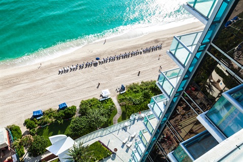 View of the beach and ocean from a balcony