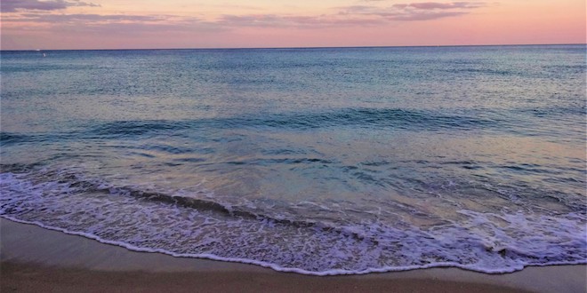 Tide coming in on the beach early in the morning.