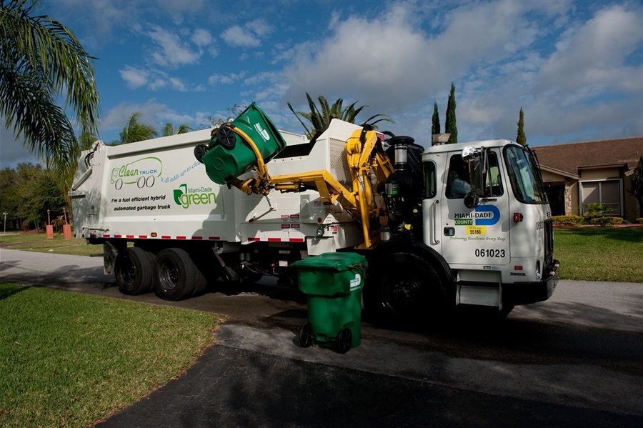 Miami-Dade County Waste Truck Collecting Recycling from single-family home.