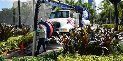 Man pumping storm drain